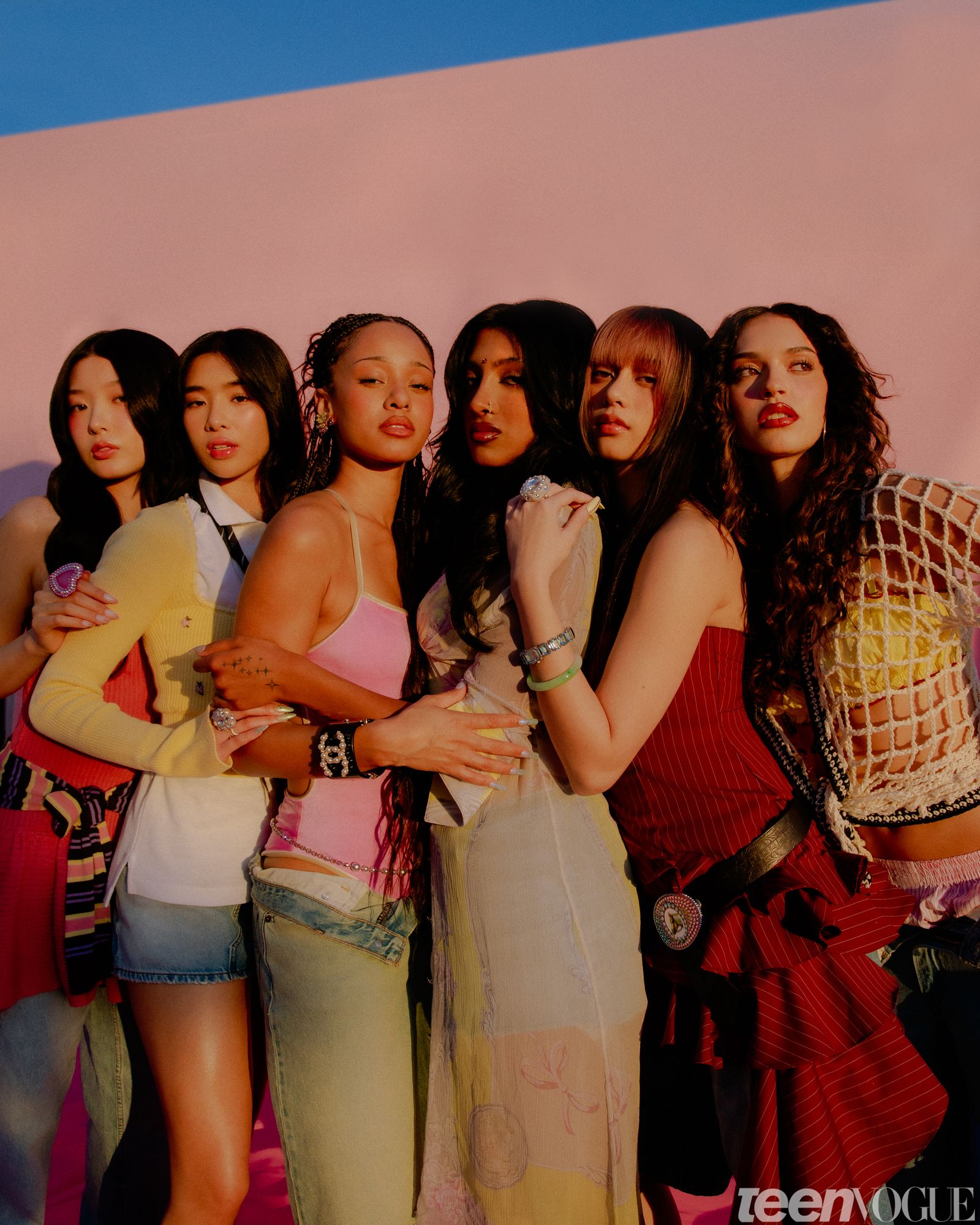 Group image of Katseye from left to right Yoonchae Sophia Manon Lara Megan and Dani. All are photographed in the golden...
