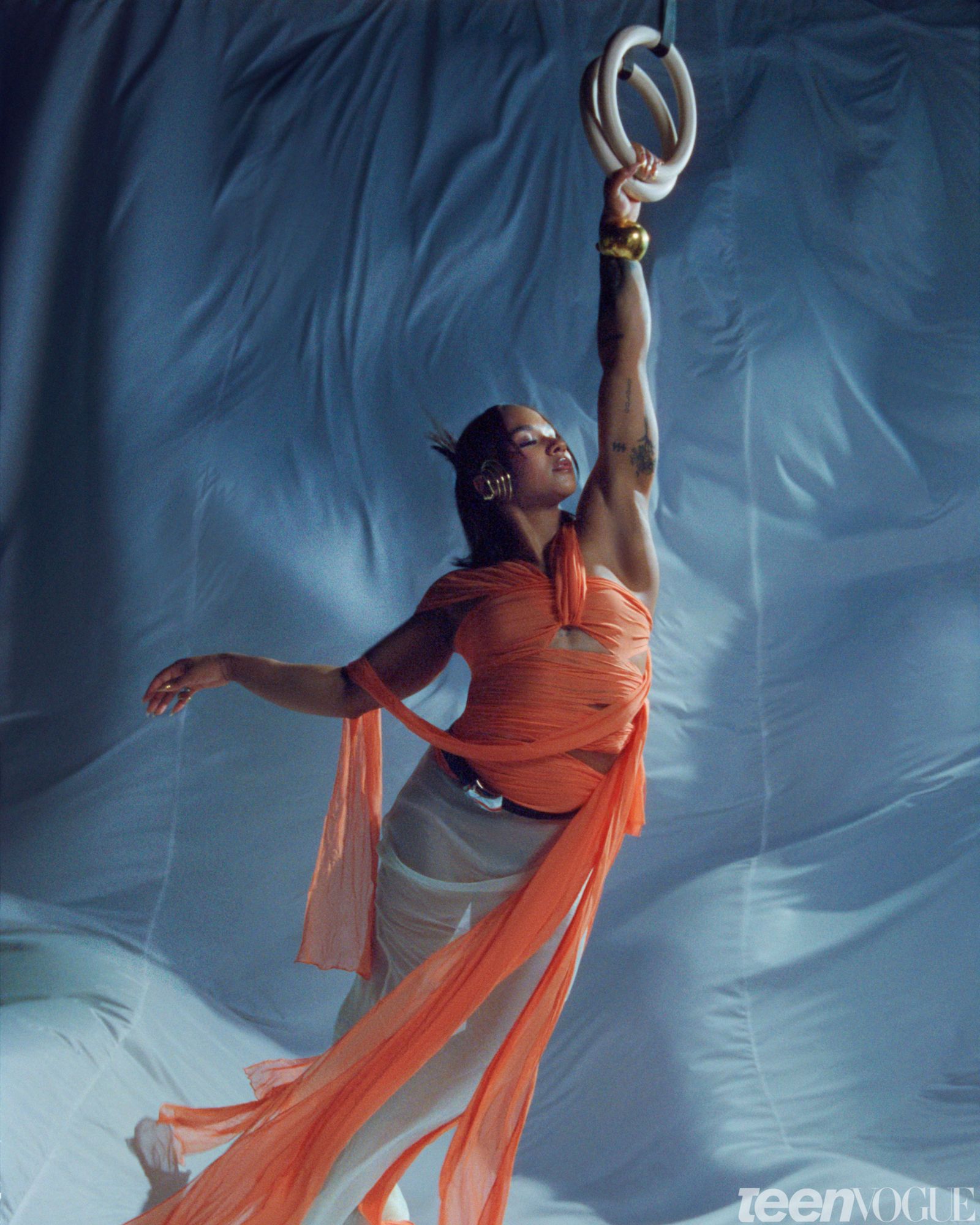 Portrait of the gymnast and Olympic Medalist Jordan Chiles holding gymnastics rings.