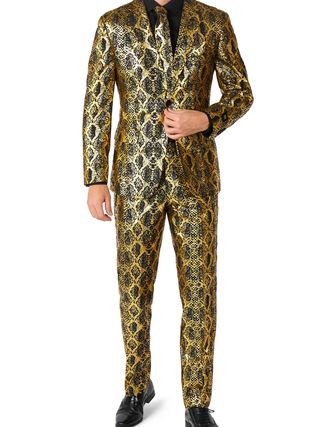 Image may contain Clothing Formal Wear Suit Adult Person Tuxedo Footwear Shoe and Coat