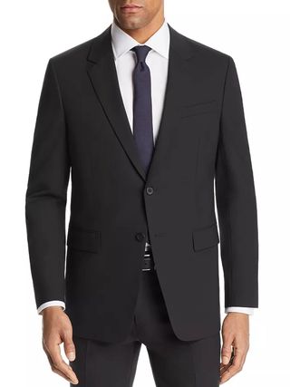 Image may contain Clothing Formal Wear Suit Tuxedo Coat Jacket Blazer Accessories and Tie