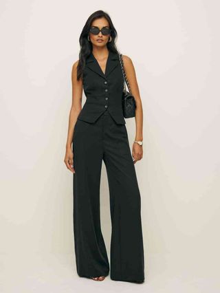 Image may contain Gizele Oliveira Clothing Pants Formal Wear Suit Vest Blazer Coat Jacket Dress Adult and Person
