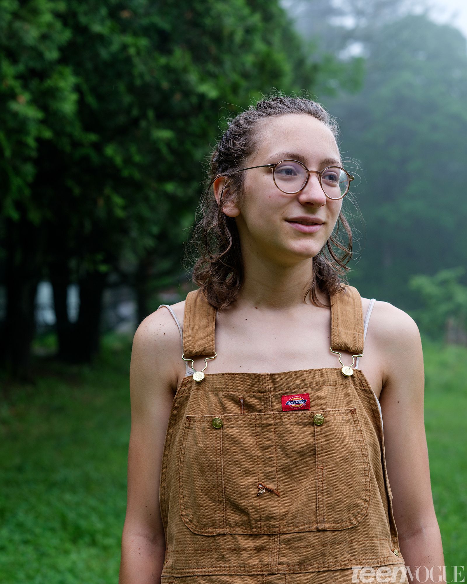 Portrait of Jo Fuchs photographed looking away from viewer on a rainy day in Shutesbury Massachusetts.