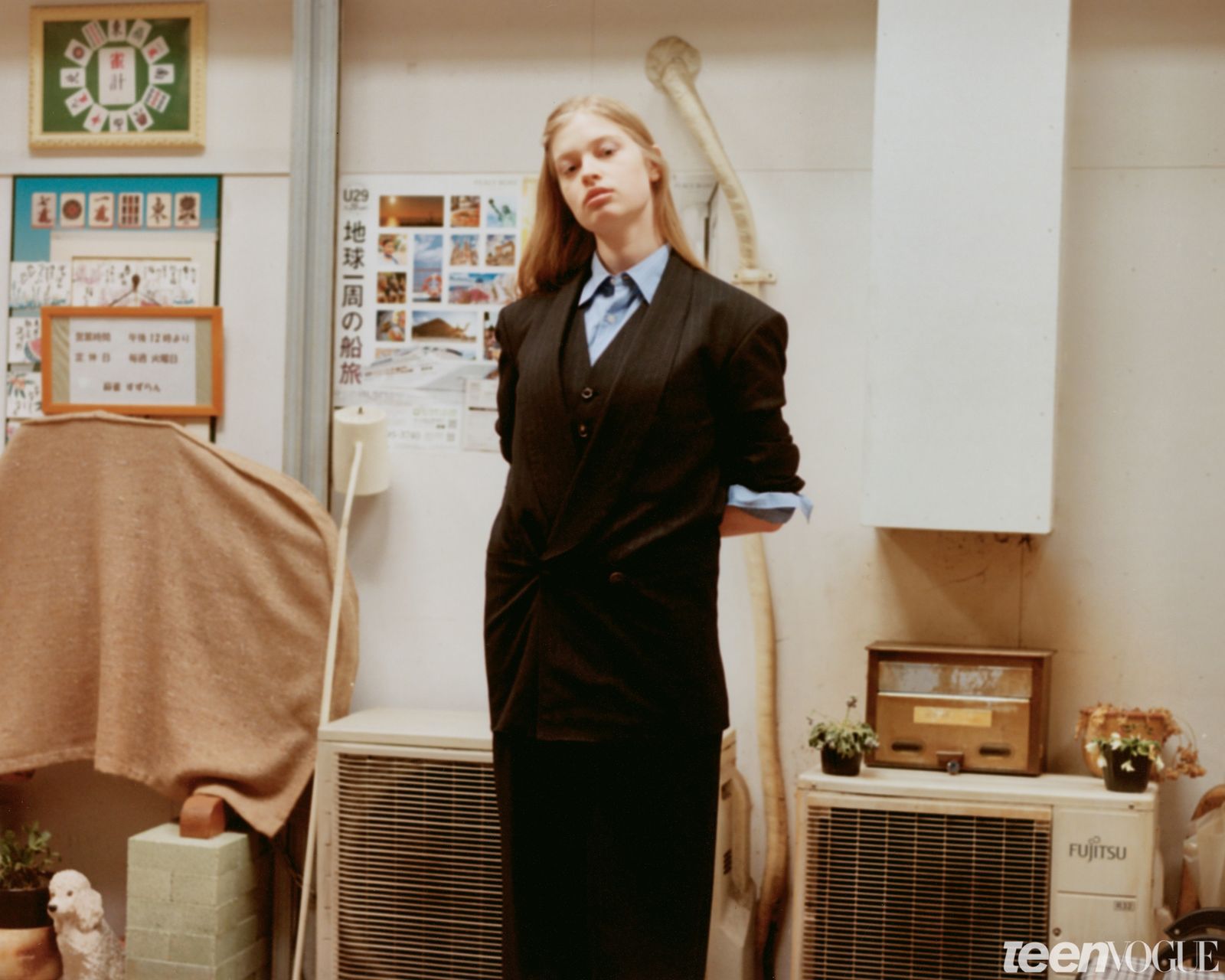 Vivian pictured wearing a matching jacket and pants with her hands behind her back.